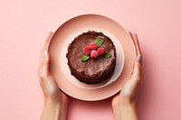 Chocolate cake dish dessert holding berry. AI generated Image by rawpixel.