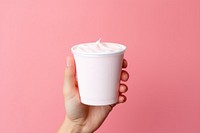 Strawberry yogurt cup holding hand mug. AI generated Image by rawpixel.