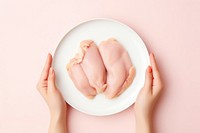 Chicken steak hand plate food. AI generated Image by rawpixel.