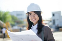 Asian Women Architect wearing hard hat smiling holding hardhat. AI generated Image by rawpixel.