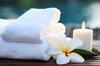 Spa towel white candle with frangipani tranquility relaxation holiday. AI generated Image by rawpixel.