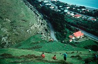 Archaeological party at lunch on crest of inland cliff directly above Paekakariki railway station (18 September 1960) by Leslie Adkin.