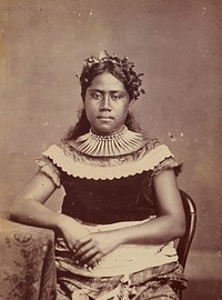 Young woman sitting at table. From the album: Tahiti, Samoa and New Zealand scenes (1885-1900).