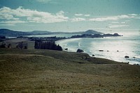 View from hillslopes near Puketeraki showing Karitane (Huri-awa) Peninsula, Waikouaiti Roads and Cornish Head beyond - a beautiful coast (24 March 1959-13 April1959) by Leslie Adkin.