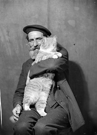 Man holding cat (circa 1935-1939) by Marion Queenie Kirker.