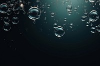 Bubbles water on dark backgrounds condensation transparent. AI generated Image by rawpixel.