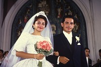 Hispanic couple wedding flower ceremony. 