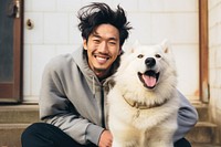 Korean man smile dog mammal. AI generated Image by rawpixel.