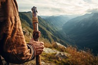 Hand holding hiking stick adventure landscape mountain. AI generated Image by rawpixel.