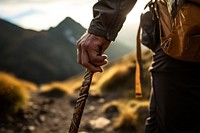 Hand holding trekking pole adventure hiking mountain. AI generated Image by rawpixel.