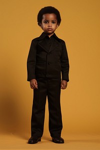 Little black kid portrait standing tuxedo. AI generated Image by rawpixel.