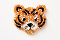 Cute tiger cartoon brooch bead white background. AI generated Image by rawpixel.