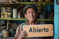 Mexican business owner holding adult sign. AI generated Image by rawpixel.