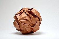 Crumpled paper ball origami brown art. AI generated Image by rawpixel.