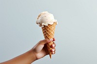 A hand holding a melting earth ice-cream dessert waffle food. AI generated Image by rawpixel.
