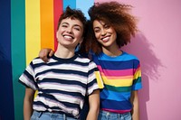 Smiling Lesbian couple laughing standing portrait. 