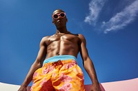 Man wearing swimming shorts fashion adult barechested. AI generated Image by rawpixel.