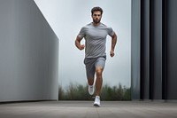 Man running in sports outfit footwear jogging shorts. AI generated Image by rawpixel.