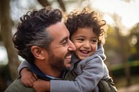 Hispanic father and son photography laughing portrait. AI generated Image by rawpixel.