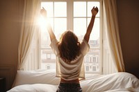 Woman wakes up bedroom window happy. AI generated Image by rawpixel.