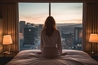 Woman wakes up bed architecture cityscape. AI generated Image by rawpixel.