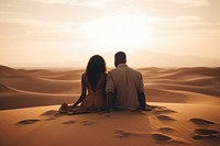 Black couple desert outdoors sitting. AI generated Image by rawpixel.