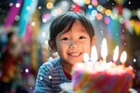 8th birthday party of Indonesian boy cake blowing dessert. 