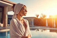 Young woman relaxing doing spa outdoors swimming towel. AI generated Image by rawpixel.