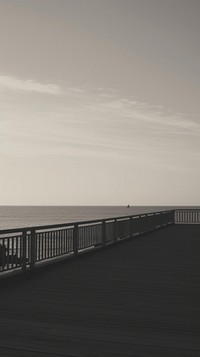 The pier boardwalk outdoors horizon. 