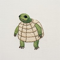 Turtle wears a sweater embroidery pattern reptile. AI generated Image by rawpixel.