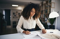 A multiracial woman architect writing working adult. AI generated Image by rawpixel.
