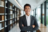 Asian business man standing smiling office. AI generated Image by rawpixel.