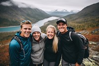 Family and friends hiking adventure mountain portrait. 