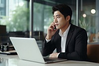 Asian young business man sales manager making phone call laptop computer talking. AI generated Image by rawpixel.