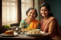 Senior women and a girl teenager south asian food adult happy. 