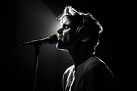 Singer with microphone photography headphones monochrome. AI generated Image by rawpixel.