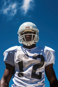 American football player standing helmet sports. AI generated Image by rawpixel.