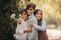 Children hugging each other smiling family togetherness. AI generated Image by rawpixel.