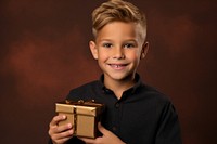 Child holding gift box portrait smiling smile. 