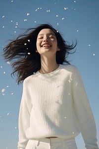 Vietnamese woman sweater laughing portrait. AI generated Image by rawpixel.
