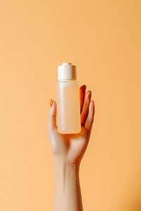 A hand holding product bottle refreshment container. AI generated Image by rawpixel.