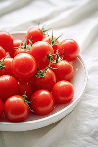 Cherry tomato food vegetable plate. AI generated Image by rawpixel.