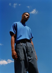 Black young man standing fashion adult. AI generated Image by rawpixel.