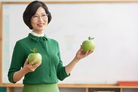 Teacher holding female apple. AI generated Image by rawpixel.