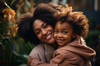 African American woman hugging people adult. 