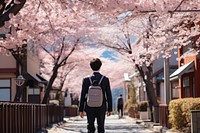 Japanese student wearing uniform walking street architecture. AI generated Image by rawpixel.
