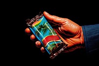 Hand holding a Chocolate bar adult food black background. AI generated Image by rawpixel.