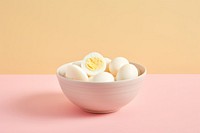 A brunch of peeled boiled eggs bowl food pink. AI generated Image by rawpixel.