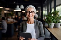A senior business woman computer glasses smiling. AI generated Image by rawpixel.
