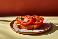 Baked tomato bread plate food. AI generated Image by rawpixel.